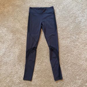 Ivivva, size 14, grey leggings with mesh cutouts.